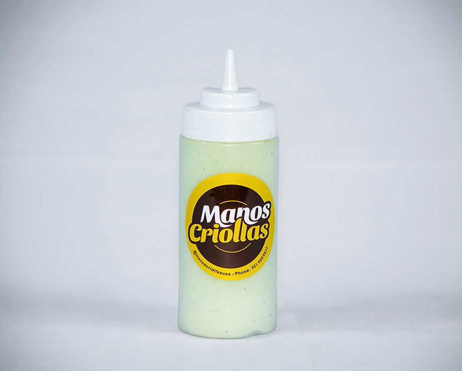 Manos Criollas creamy garlic sauce bottle, Latin dipping sauce for empanadas and tequeños.